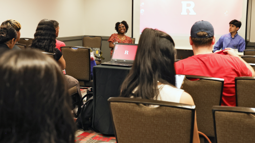Students listening in on a panel discussion
