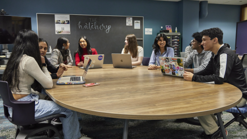 Aresty students sitting around a conference table in The Hatchery