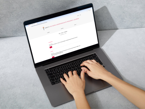Smart mockup of the fifth edition of the Aresty Undergraduate Research Journal being viewed on a laptop