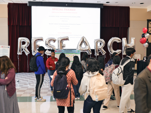 Students walking around at the Undergraduate Research Discovery Day