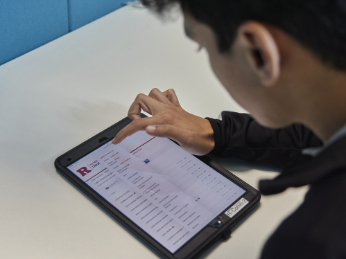 A student looking at library resources for humanities on an iPad