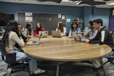 Aresty students sitting around a conference table in The Hatchery