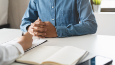 A student is being interviewed by a faculty researcher
