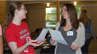 Two peer instructors at the annual orientations. 