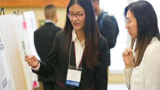 Presenting discussing her research at the Aresty symposium.